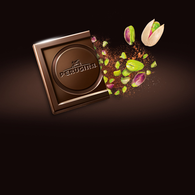 Cioccolato fondente Perugina Pistacchio, l'eleganza del cioccolato fondente incontra la croccantezza della granella di pistacchio.