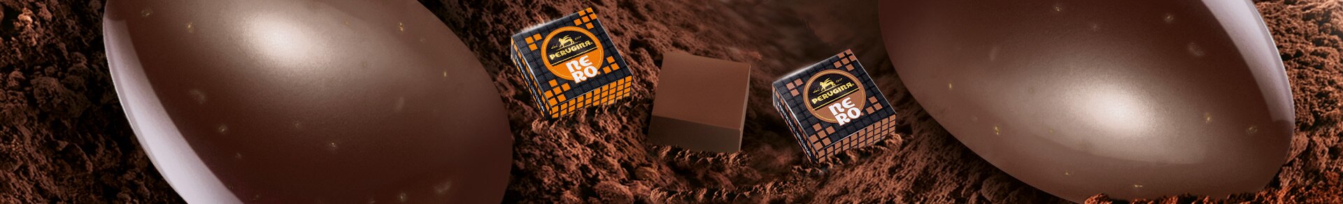Uovo Perugina® Nero® al Cioccolato Fondente Gusto Arancia e Granella di Mandorle e un cioccolatino Perugina® Nero® Arancia Intensa Uovo Perugina® Nero® al Cioccolato Fondente Gusto Arancia e Granella di Mandorle e un cioccolatino Perugina® Nero® Arancia Intensa