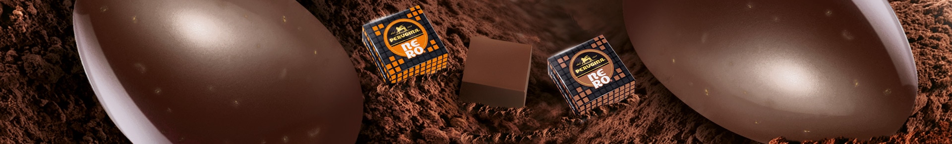 Uovo Perugina® Nero® al Cioccolato Fondente con Semi di Cacao e un cioccolatino Perugina® Nero® con semi di cacao Uovo Perugina® Nero® al Cioccolato Fondente con Semi di Cacao e un cioccolatino Perugina® Nero® con semi di cacao